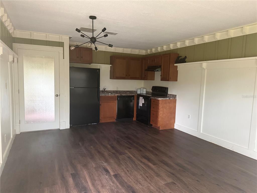8330 Northeast 100th Avenue Bronson, FL 32621 - Photo 13 of 17 a kitchen with stainless steel appliances a refrigerator and a stove top oven