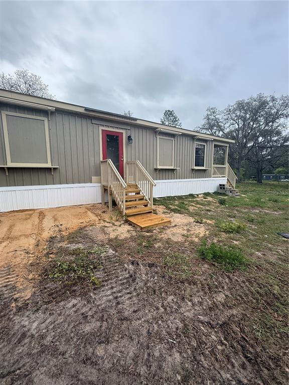 8330 Northeast 100th Avenue Bronson, FL 32621 - Photo 15 of 17 a view of a house with backyard and sitting area