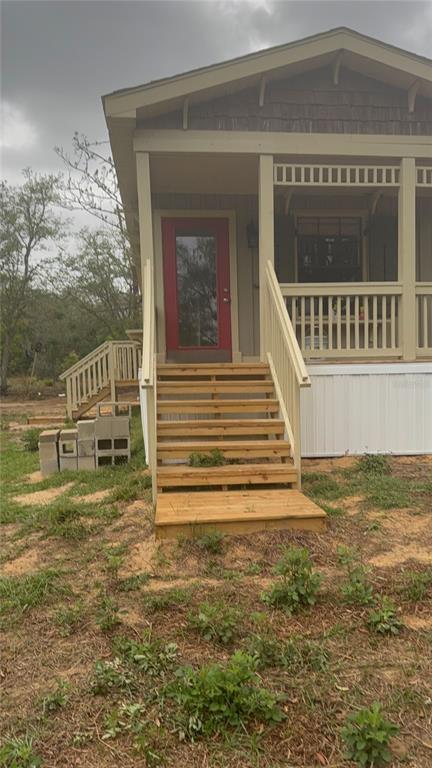 8330 Northeast 100th Avenue Bronson, FL 32621 - Photo 2 of 17 a view of a house with a yard