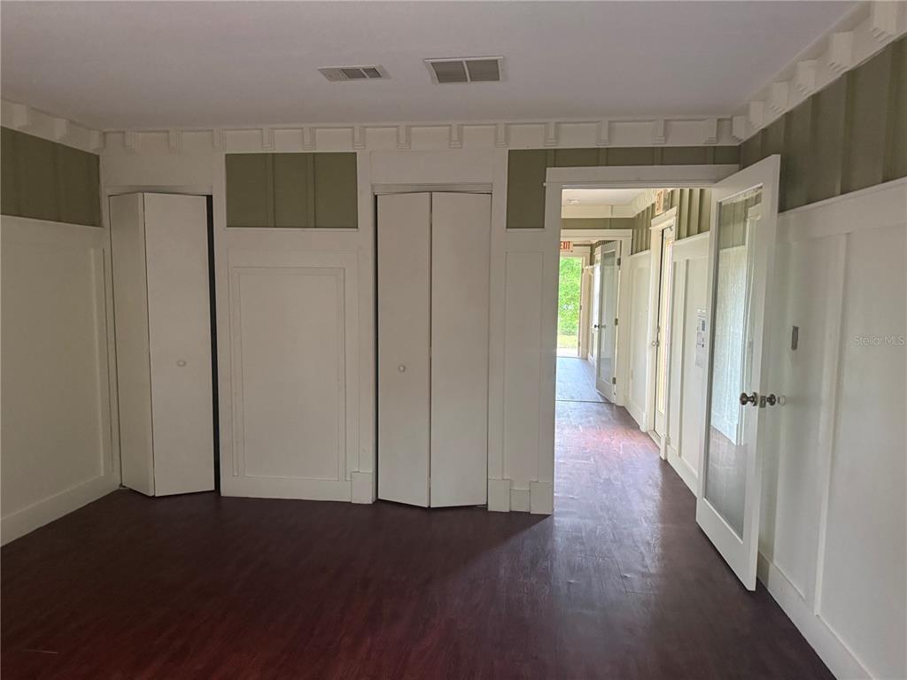 8330 Northeast 100th Avenue Bronson, FL 32621 - Photo 8 of 17 a view of hallway with wooden floor