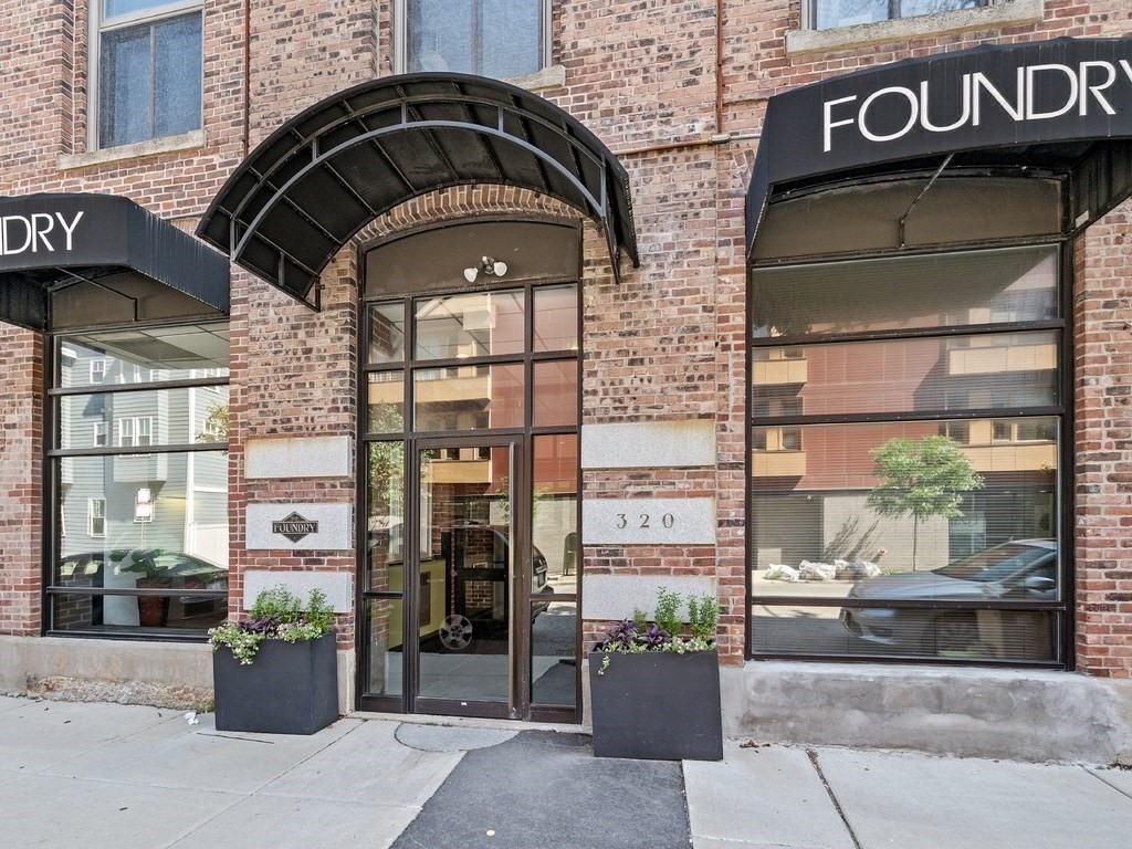 320 West 2nd Street, Unit 502 Boston, MA 02127 - Photo 18 of 21 a front view of a building with street