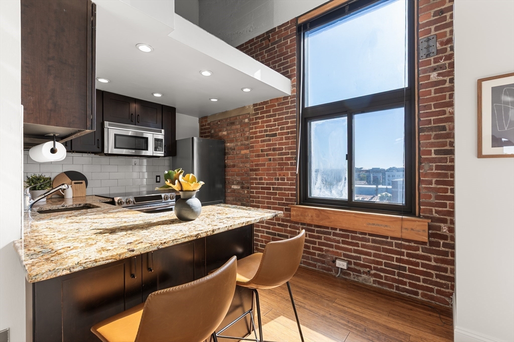 320 West 2nd Street, Unit 502 Boston, MA 02127 - Photo 4 of 21 a kitchen with a sink appliances and cabinets