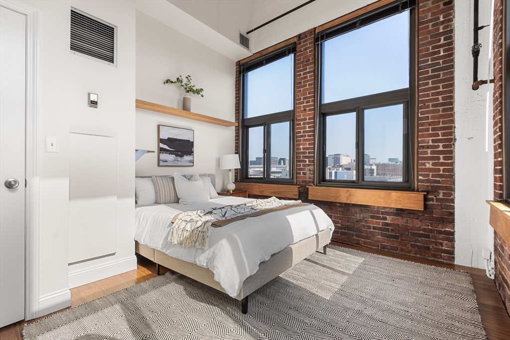 320 West 2nd Street, Unit 502 Boston, MA 02127 - Photo 9 of 21 a bedroom with a bed and a large window