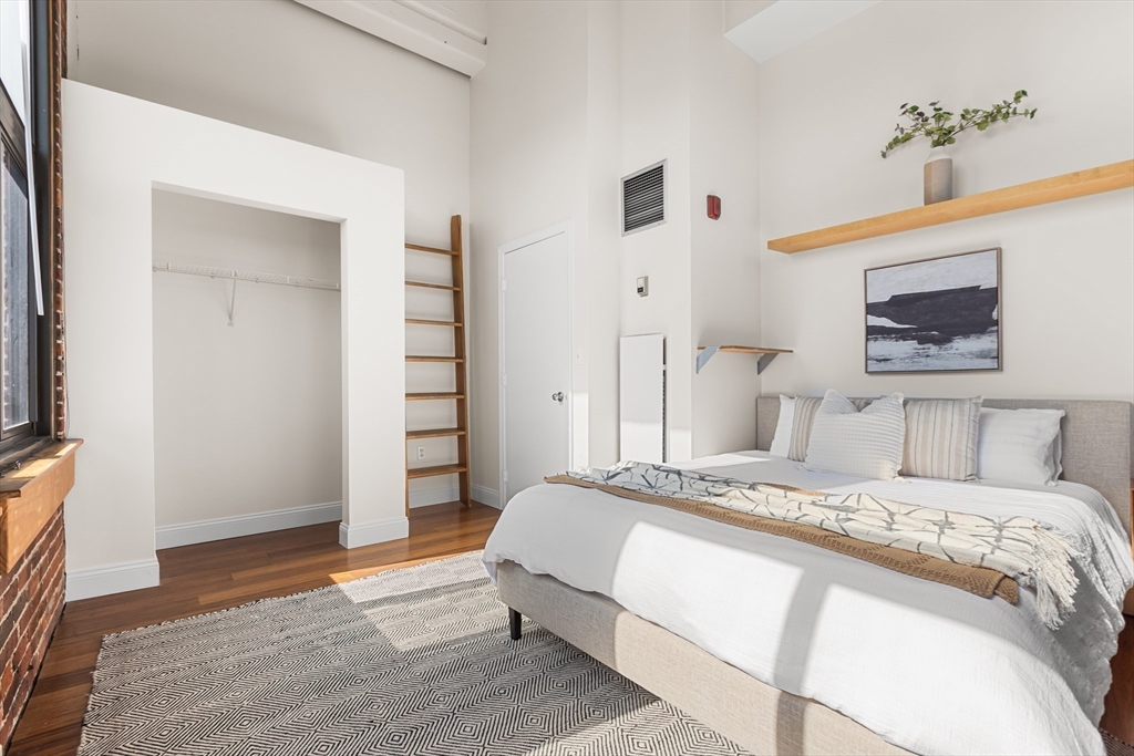 320 West 2nd Street, Unit 502 Boston, MA 02127 - Photo 10 of 21 a bedroom with a bed and a flat screen tv