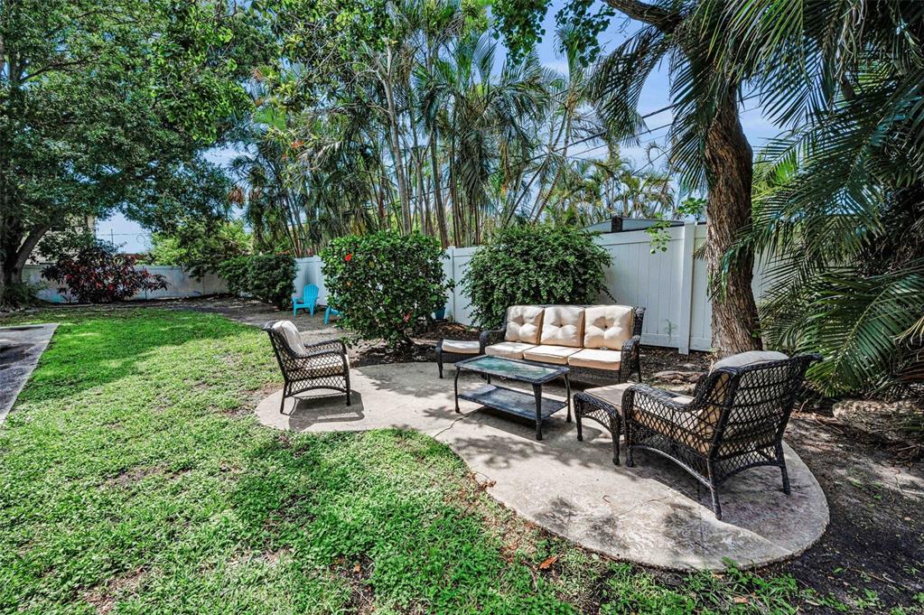 9945 47th Avenue North, Unit 210 St. Petersburg, FL 33708 - Photo 51 of 78 a view of a backyard with sitting area