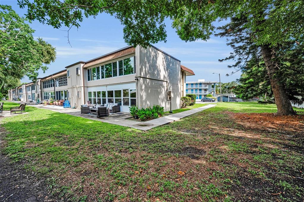 9945 47th Avenue North, Unit 210 St. Petersburg, FL 33708 - Photo 53 of 78 a view of a house with a yard