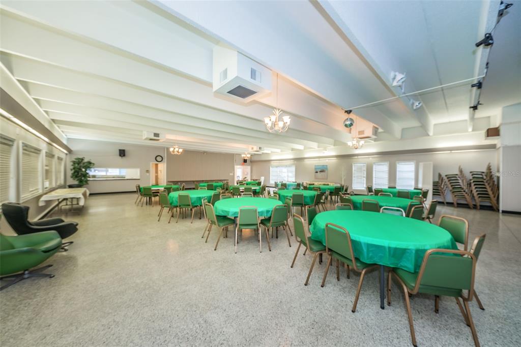 9945 47th Avenue North, Unit 210 St. Petersburg, FL 33708 - Photo 57 of 78 a view of a dining room with furniture and a livingroom
