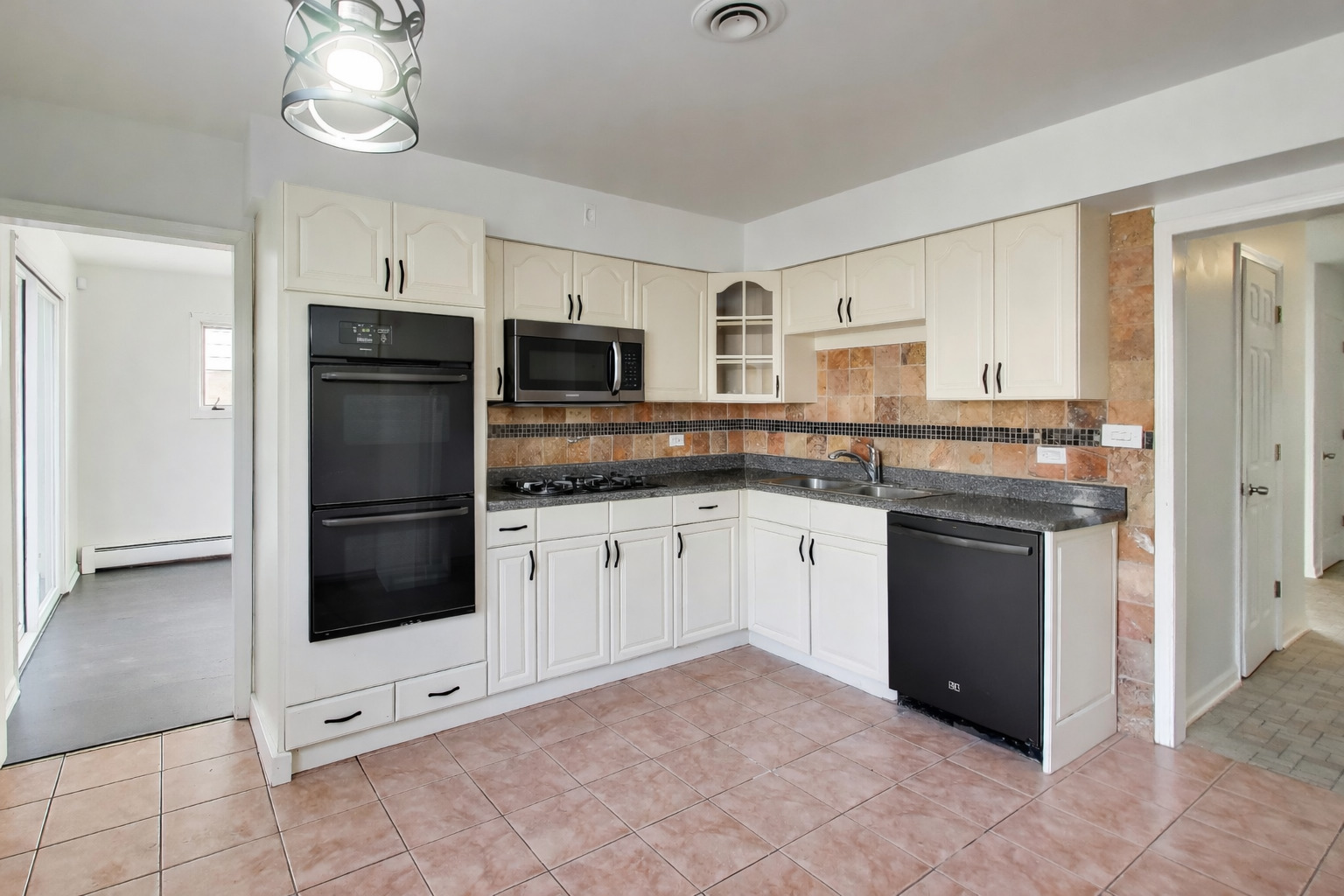 1006 Devon Avenue Park Ridge, IL 60068 - Photo 13 of 38 a kitchen with cabinets and stainless steel appliances