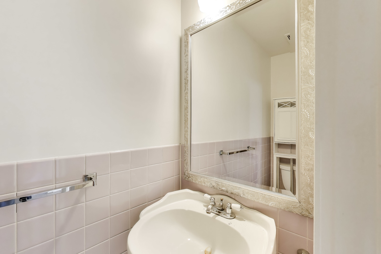 1006 Devon Avenue Park Ridge, IL 60068 - Photo 16 of 38 a bathroom with a sink and mirror