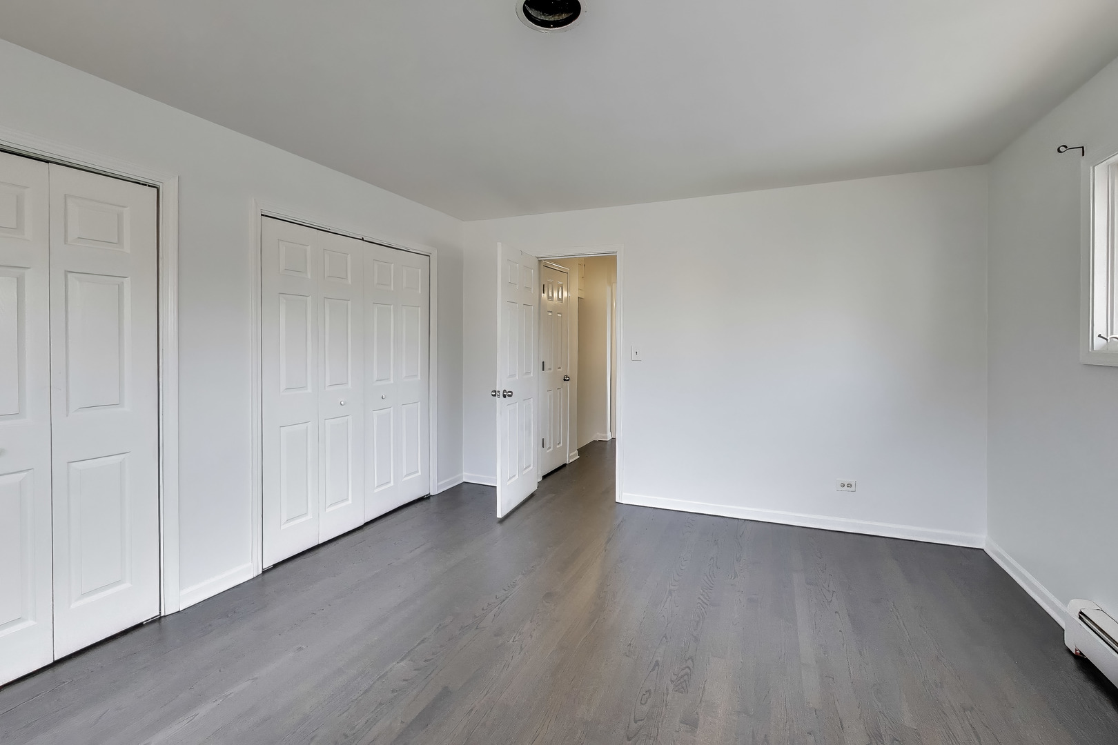 1006 Devon Avenue Park Ridge, IL 60068 - Photo 20 of 38 a view of an empty room with wooden floor