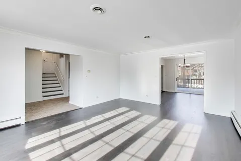 a view of a livingroom with wooden floor