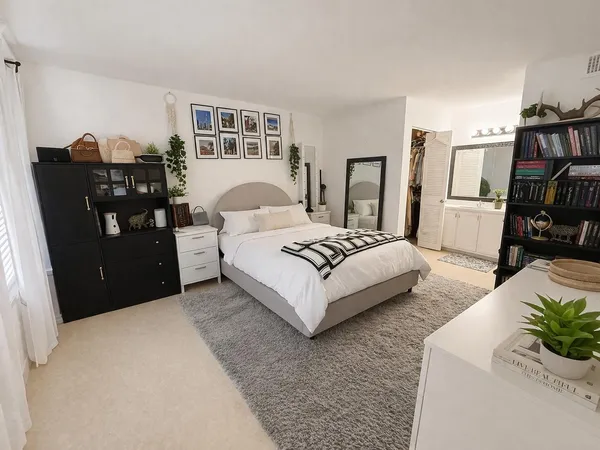 a living room with furniture and a book shelf