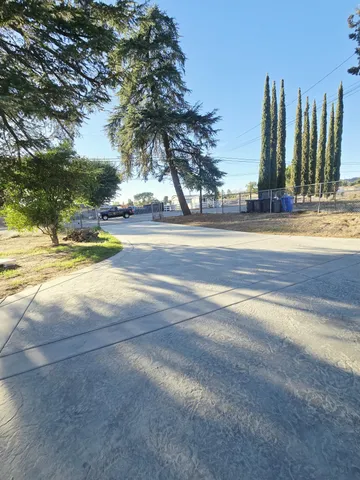 an empty room with wooden floor and door