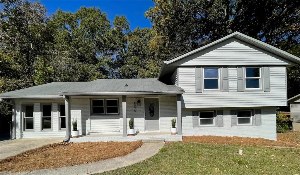 6575 Hidden Brook Trail College Park, GA 30349 - Photo 1 of 1 a front view of a house with a yard