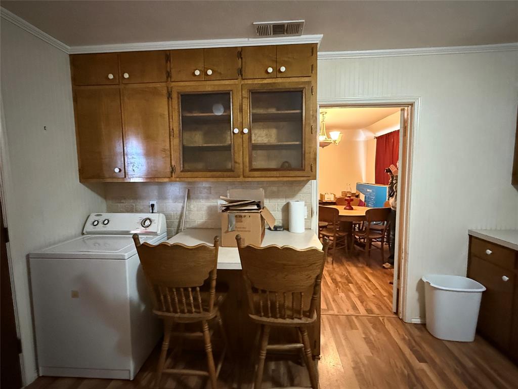609 East Henry Street Hamilton, TX 76531 - Photo 13 of 40 a kitchen with a table and chairs in it