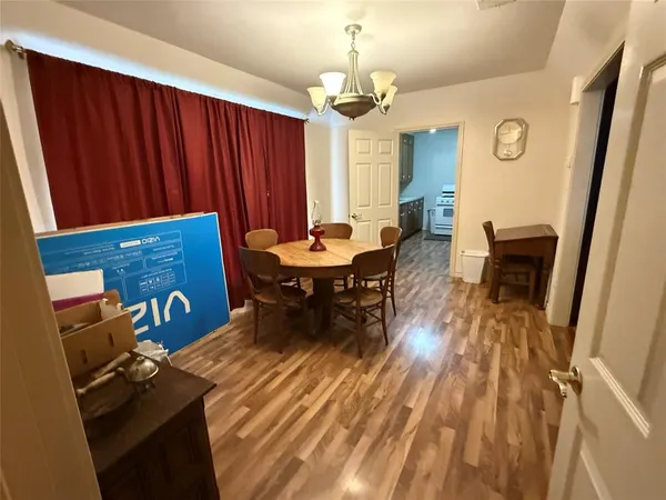 a bedroom with furniture and wooden floor