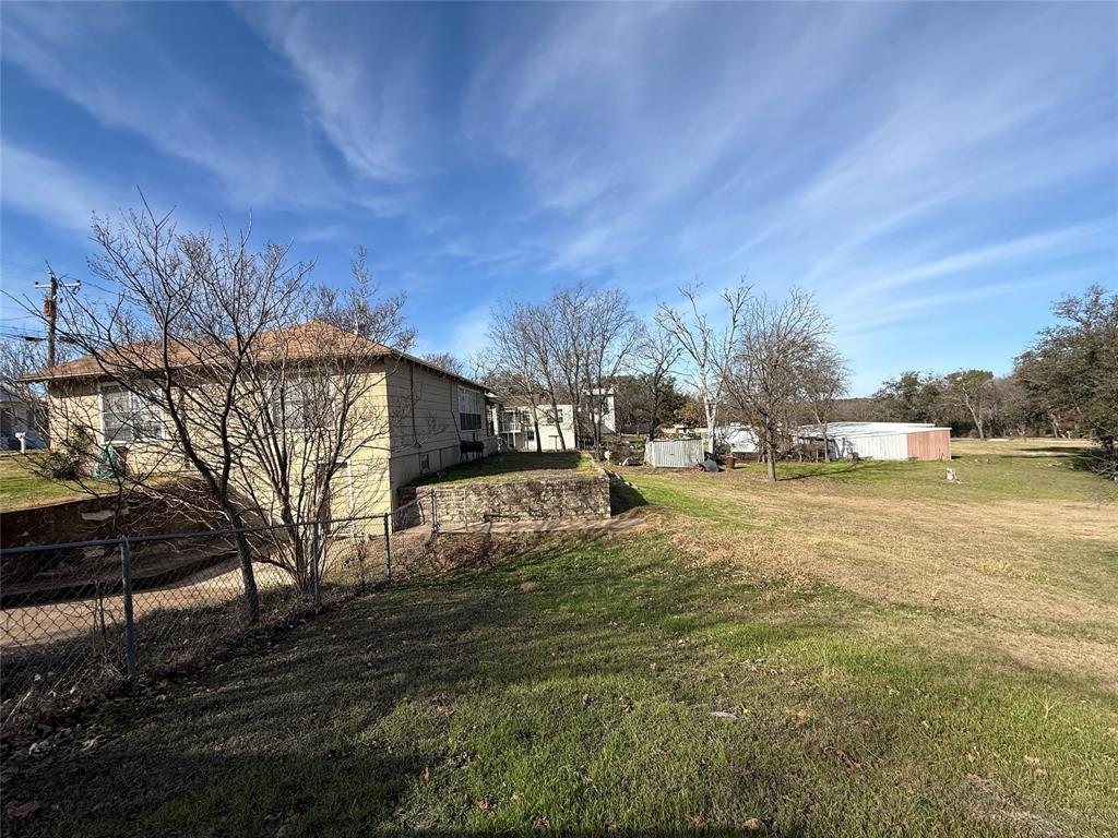 609 East Henry Street Hamilton, TX 76531 - Photo 31 of 40 a view of yard with swimming pool and green space