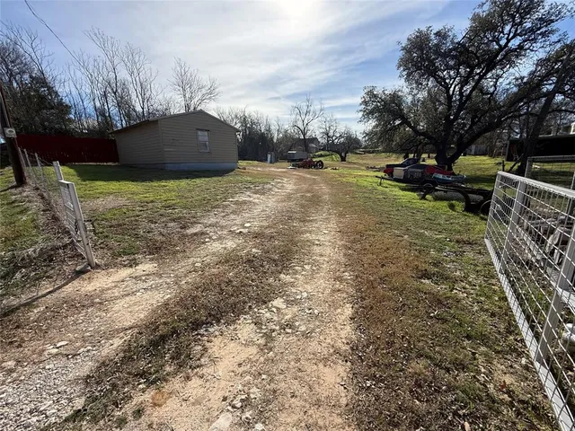 a view of a backyard with sitting area