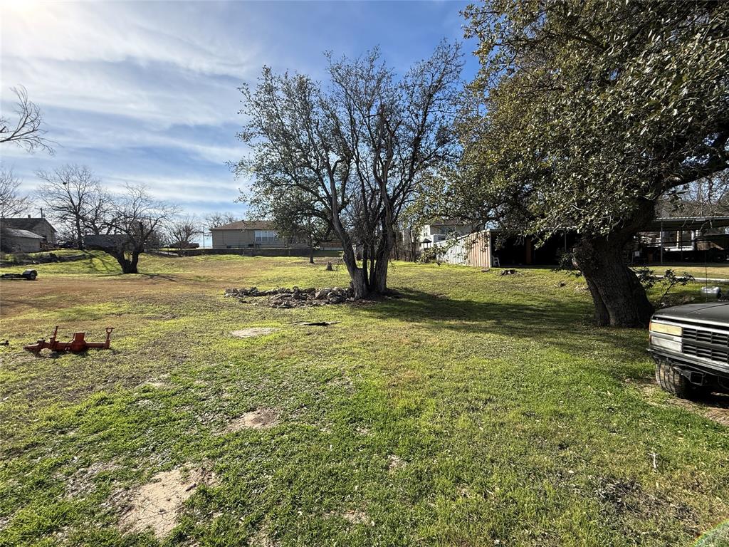 609 East Henry Street Hamilton, TX 76531 - Photo 39 of 40 a view of a yard with an outdoor space