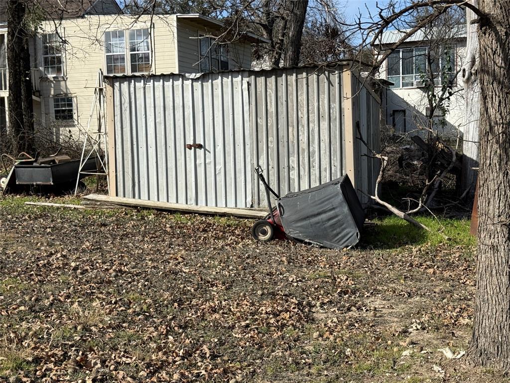 609 East Henry Street Hamilton, TX 76531 - Photo 40 of 40 a view of a backyard with sitting area