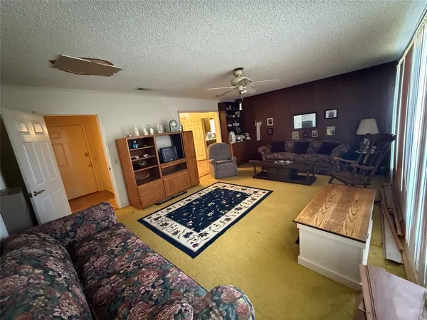 a living room with furniture and a rug