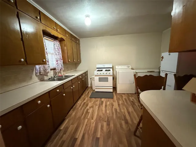 a spacious bathroom with a double vanity sink and a mirror