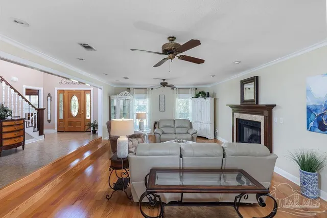 a living room with furniture and a fireplace