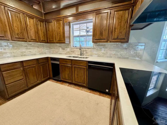 a kitchen with a sink and cabinets