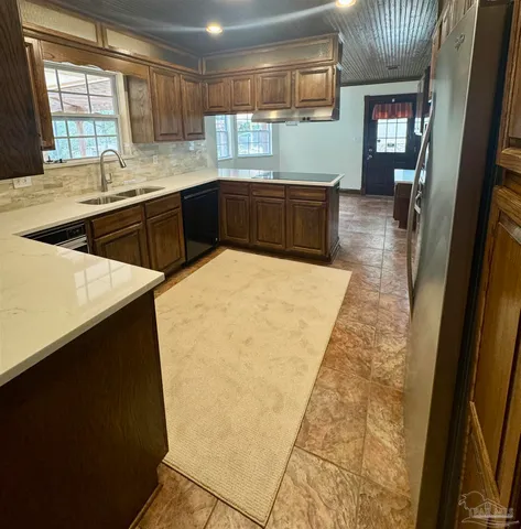 a kitchen with sink and window