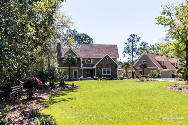 a view of a house with swimming pool and porch