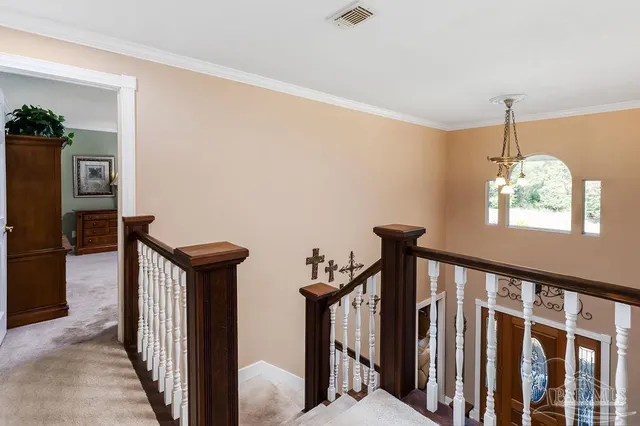 a view of a hallway with windows