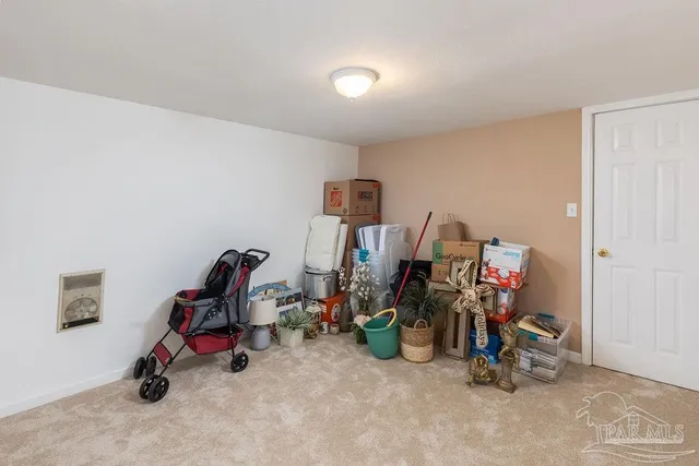 a bedroom with a bed and ceiling fan