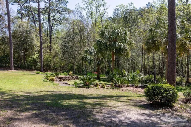 an aerial view of residential house with swimming pool and big yard