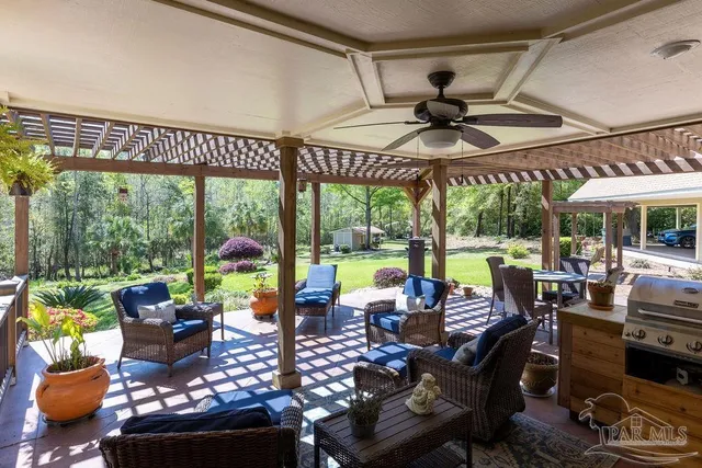 a backyard of a house with table and chairs