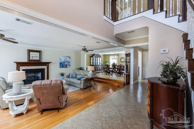 a living room with furniture and a fireplace