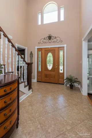 a view of a livingroom with furniture and staircase