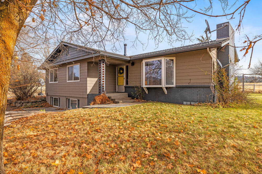23131 North Poe Valley Road Klamath Falls, OR 97603 - Photo 1 of 45 a front view of a house with a yard