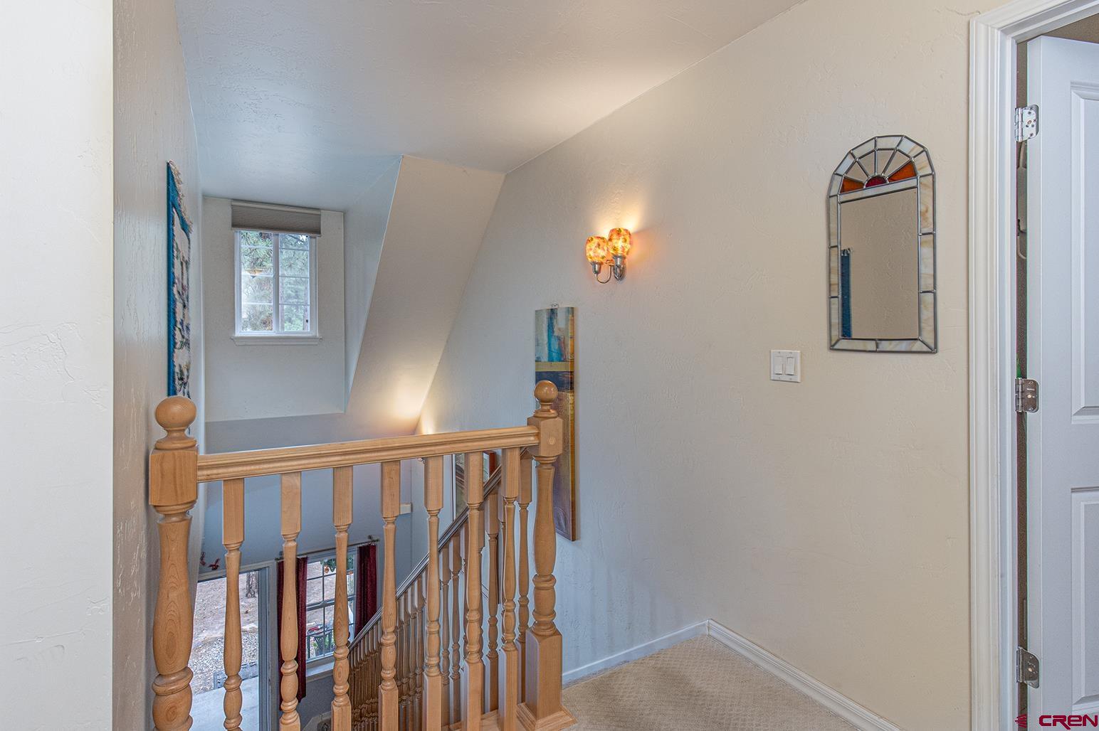 383 The Eagle Pass Durango, CO 81301 - Photo 14 of 37 a view of a livingroom with stairs