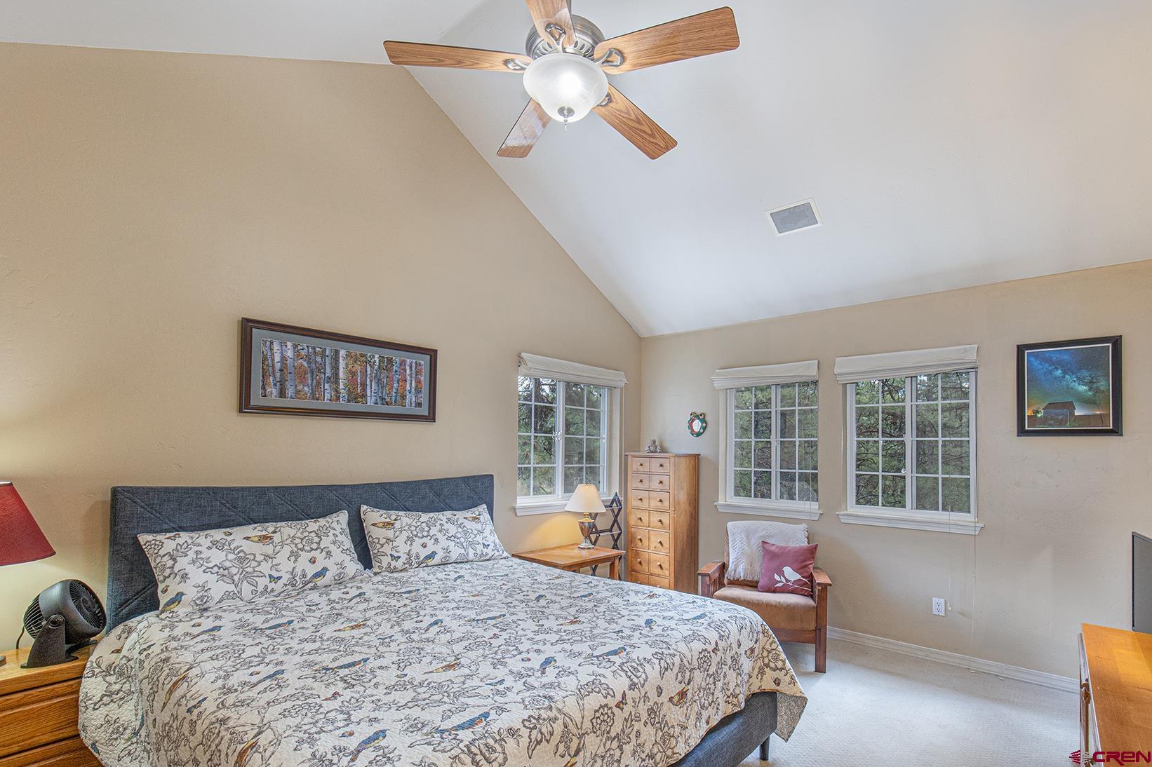 383 The Eagle Pass Durango, CO 81301 - Photo 15 of 37 a bedroom with a large bed and a window