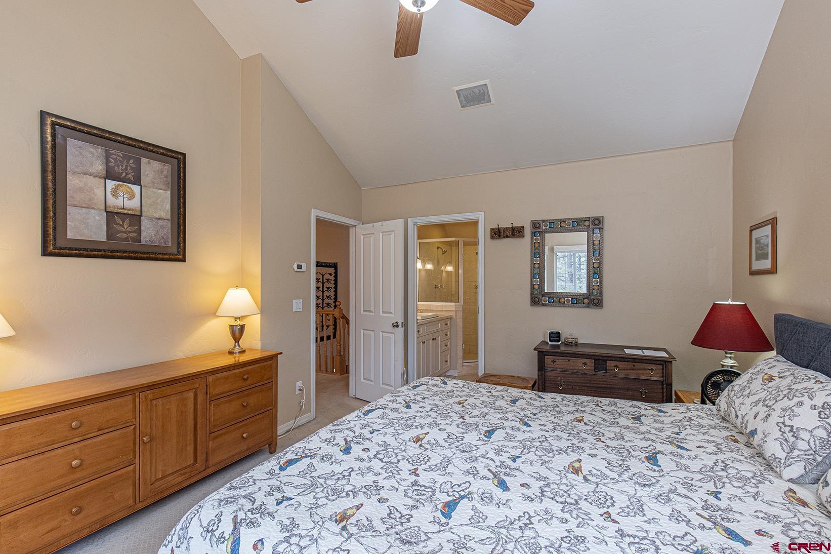 383 The Eagle Pass Durango, CO 81301 - Photo 16 of 37 a bedroom with a bed and wooden floor