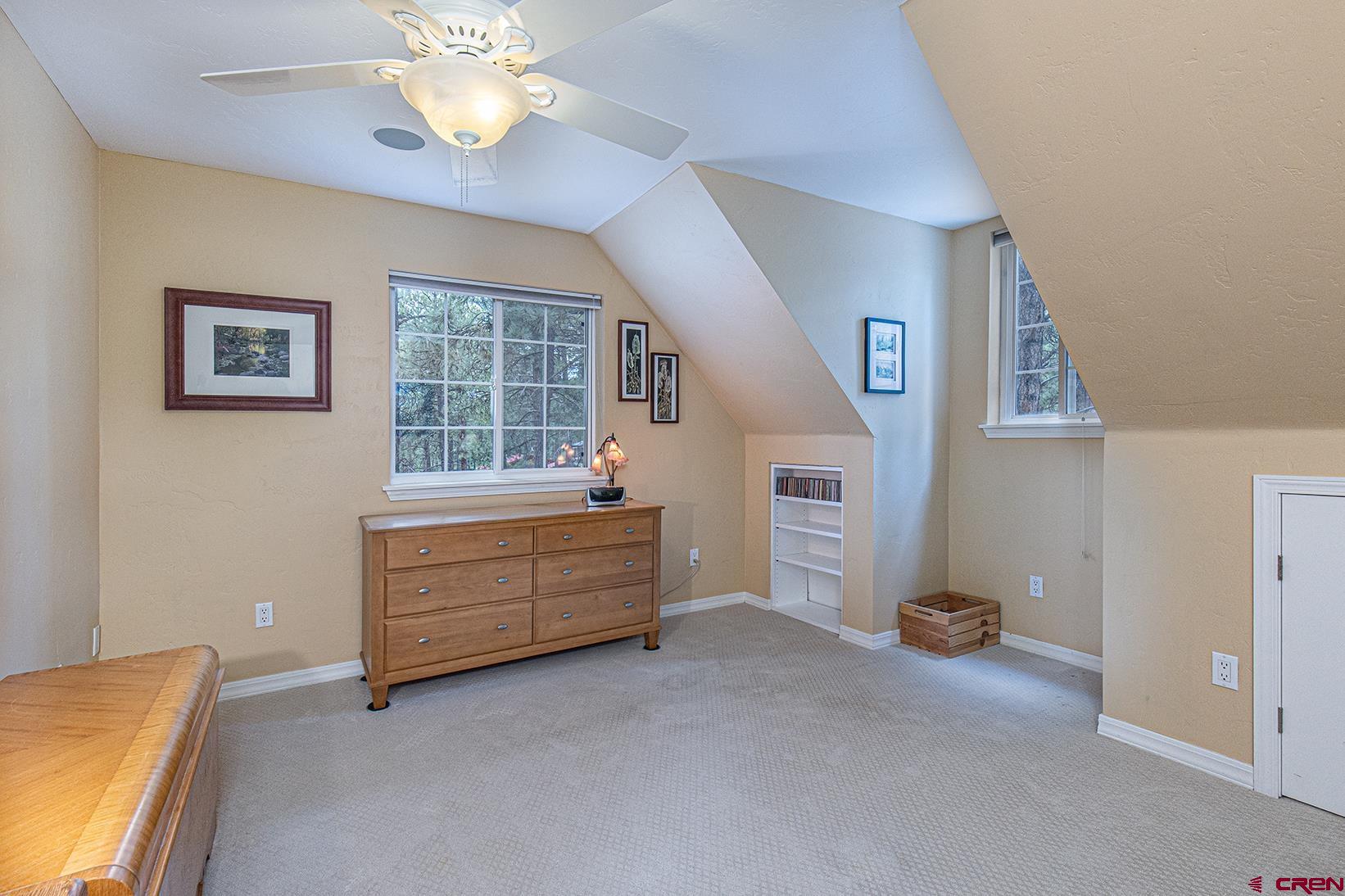 383 The Eagle Pass Durango, CO 81301 - Photo 23 of 37 a room with window and ceiling fan