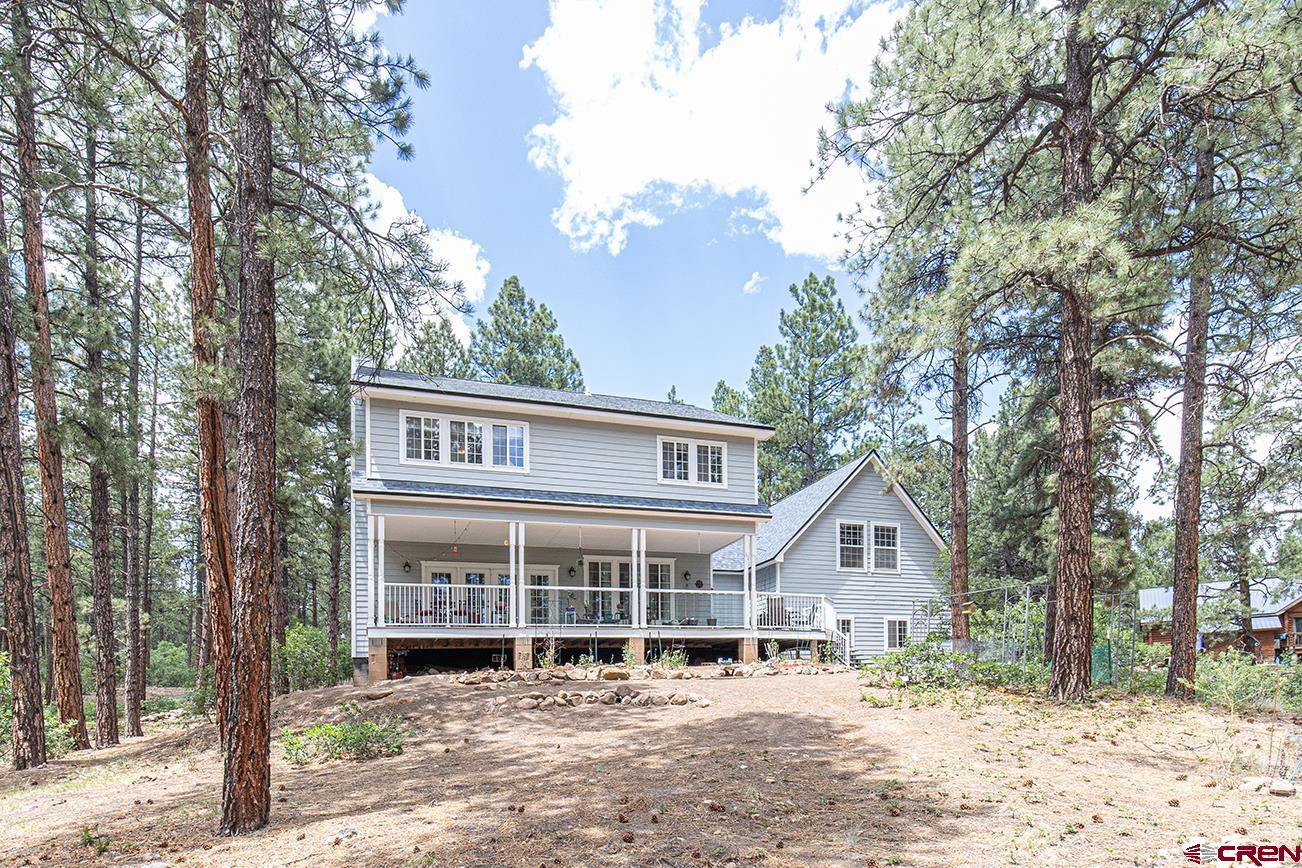 383 The Eagle Pass Durango, CO 81301 - Photo 3 of 37 front view of a house with a yard