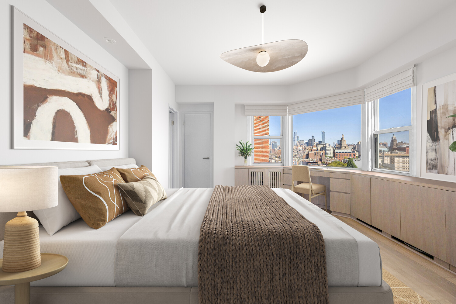 2 Charlton Street, Unit PH16F Manhattan, NY 10014 - Photo 11 of 20 a bedroom with a large bed and a view of kitchen