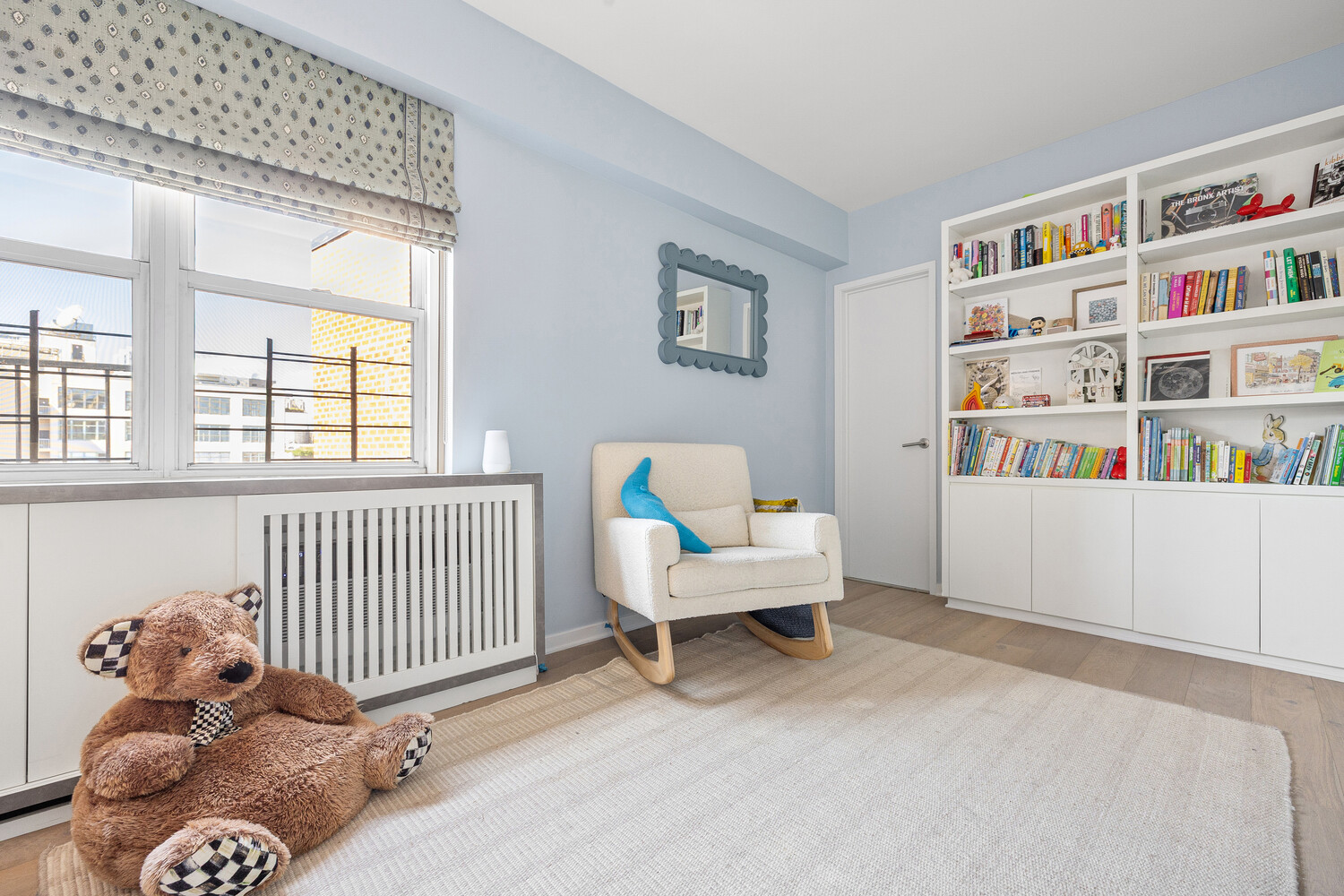 2 Charlton Street, Unit PH16F Manhattan, NY 10014 - Photo 14 of 20 a bedroom with furniture and a book shelf