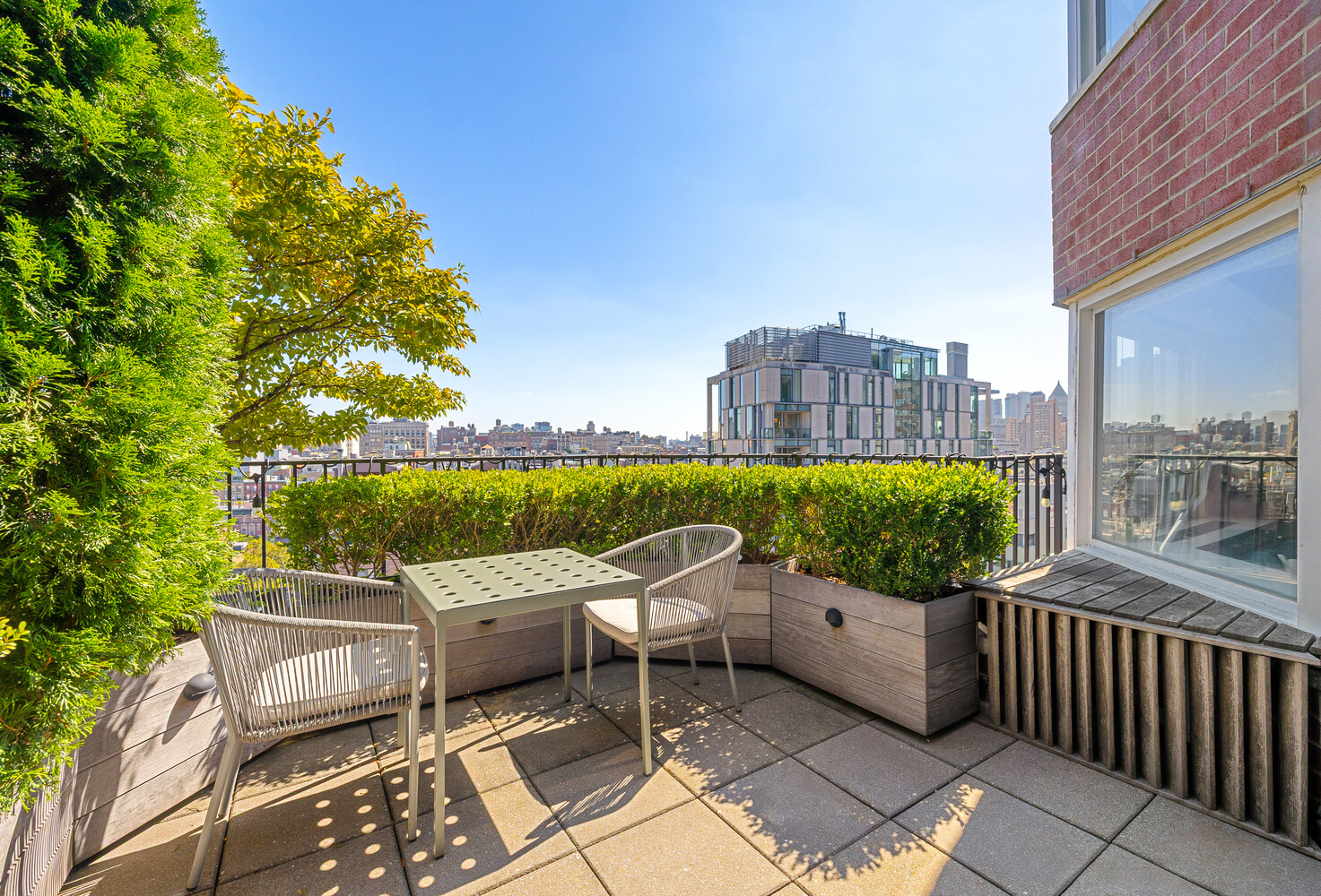 2 Charlton Street, Unit PH16F Manhattan, NY 10014 - Photo 3 of 20 a view of a chairs and table in the balcony