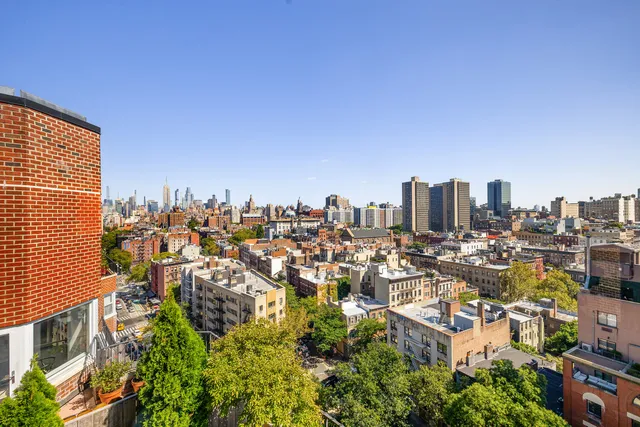 a view of a chairs and table in the balcony