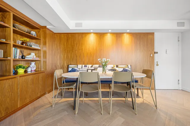 a kitchen with a table and chairs in it