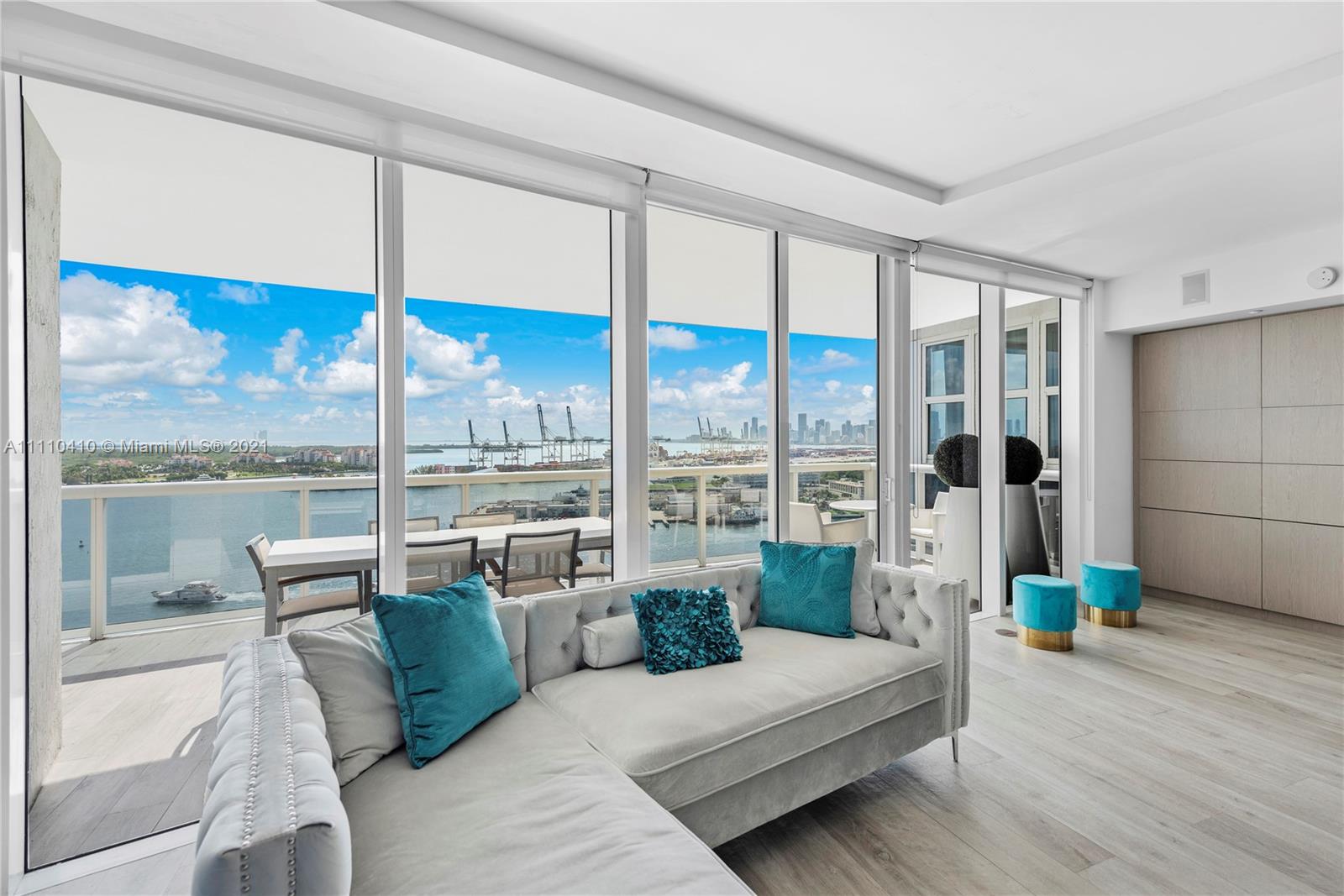 400 Alton Road, Unit 2003 Miami Beach, FL 33139 - Photo 12 of 38 a living room with furniture city view and large windows