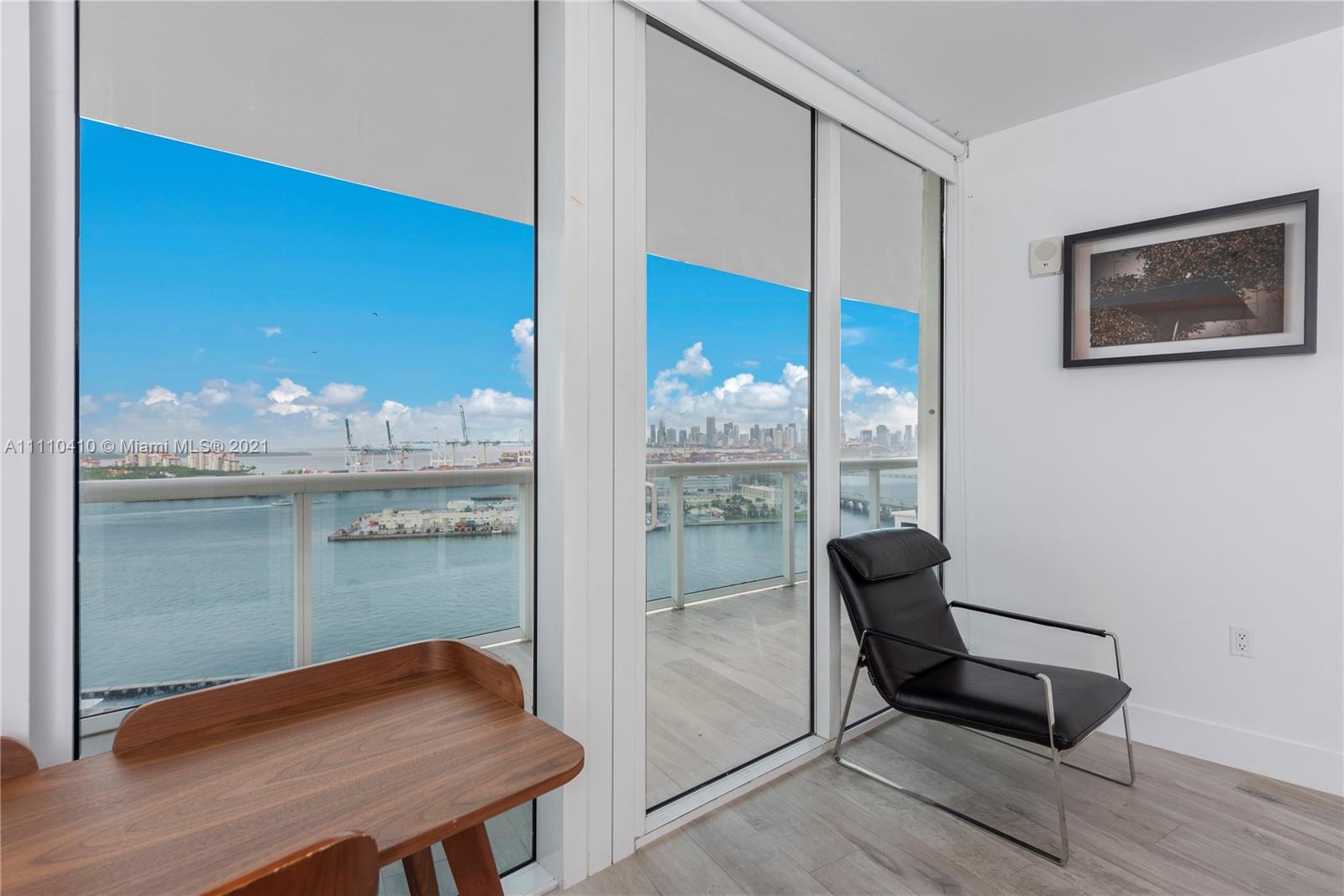 400 Alton Road, Unit 2003 Miami Beach, FL 33139 - Photo 19 of 38 a view of a floor to ceiling window and wooden floor