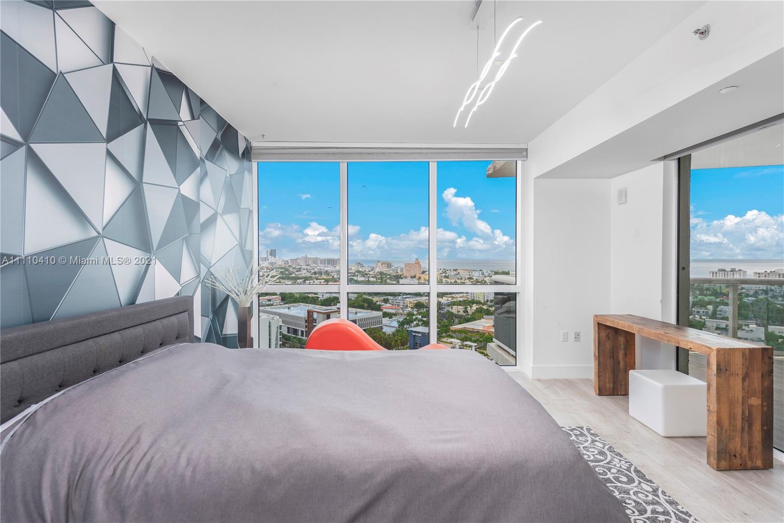 400 Alton Road, Unit 2003 Miami Beach, FL 33139 - Photo 26 of 38 a bed room with a bed and a couch